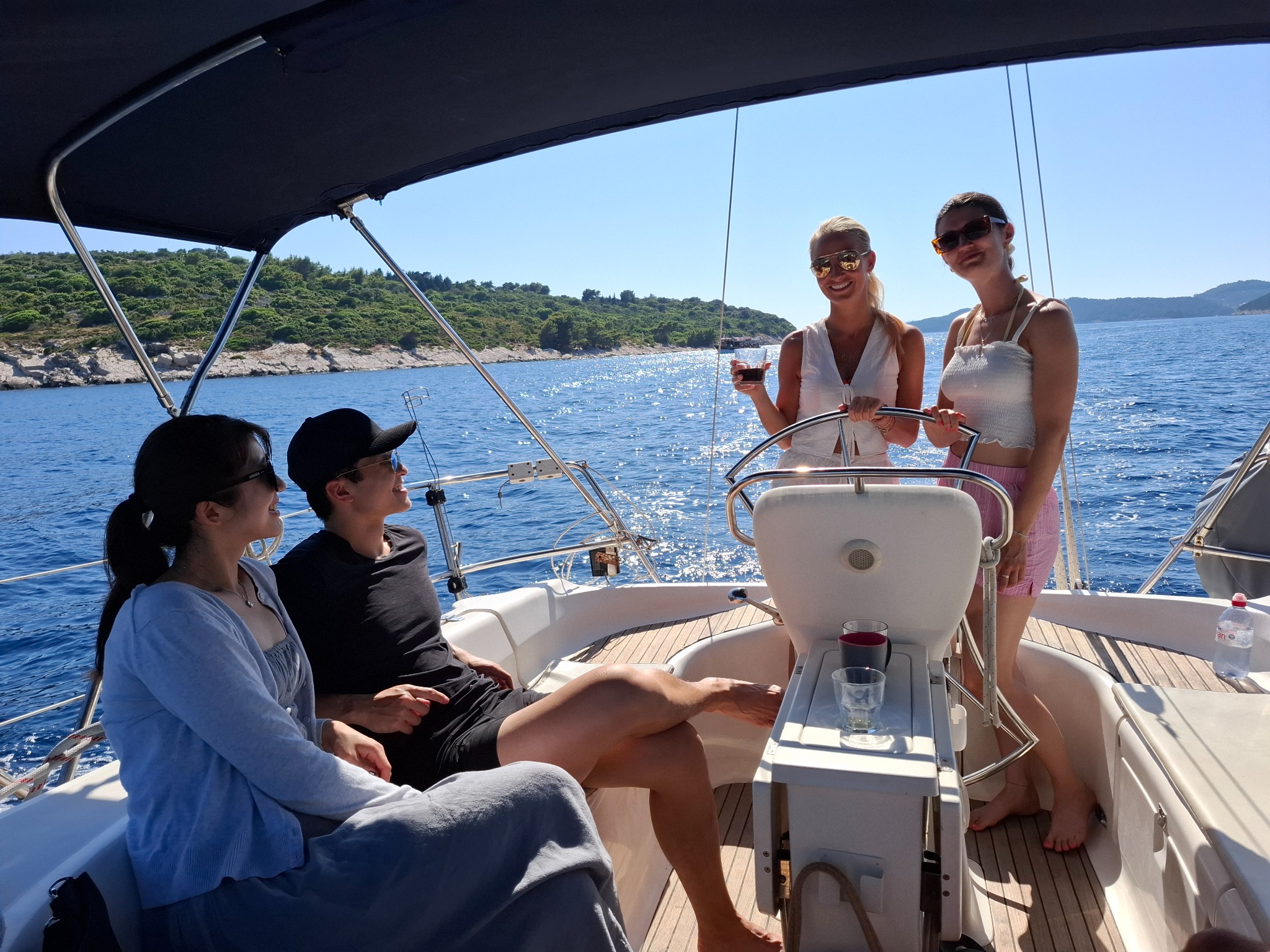Guests relaxing together on a sailing boat